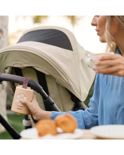Miniland Nanarock automatic stroller rocker attached to a stroller